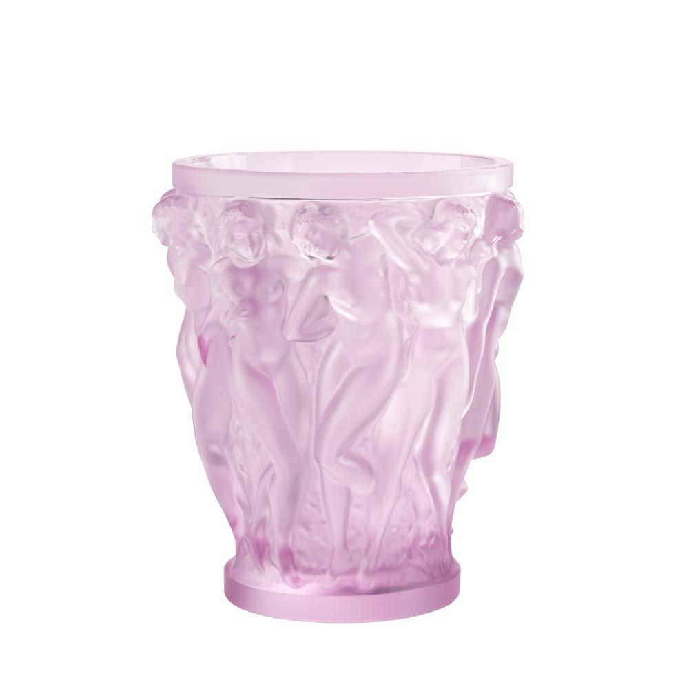 Pink glass vase with floral design on a white background