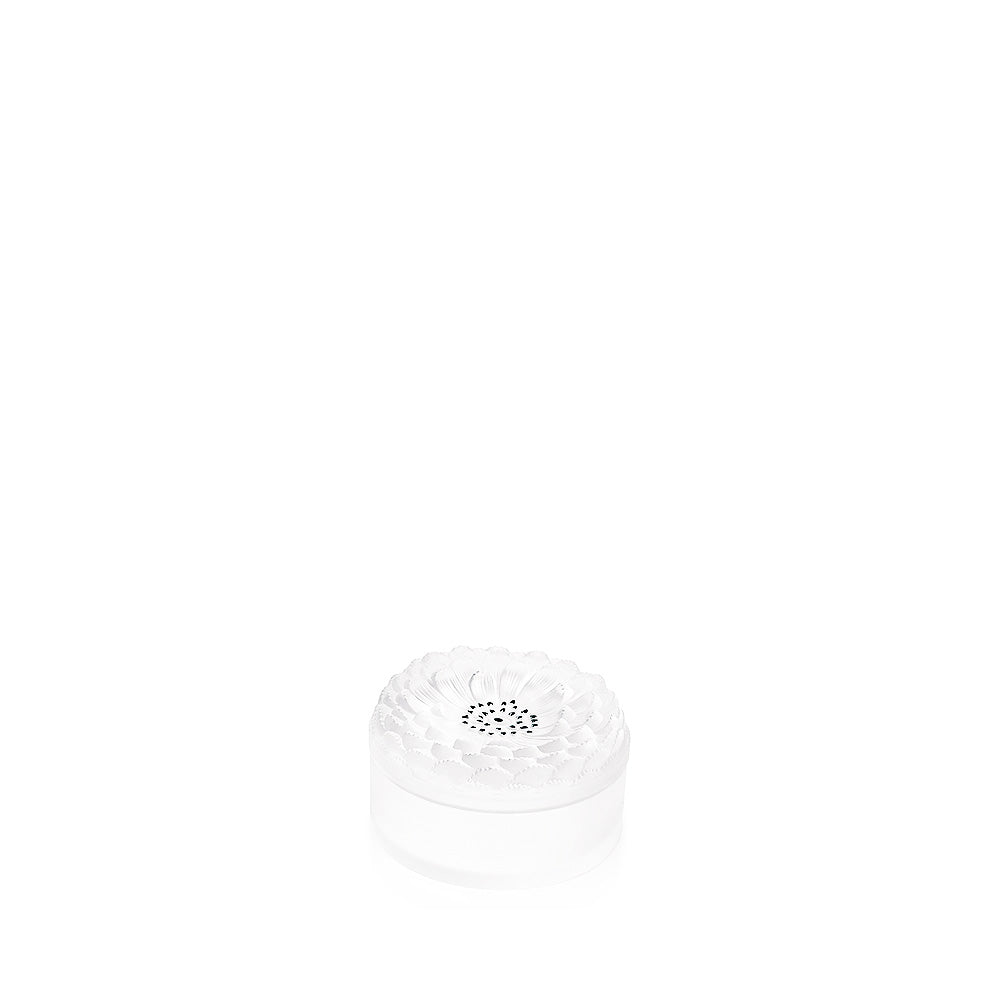 White cylindrical object with a central circular pattern on a white background