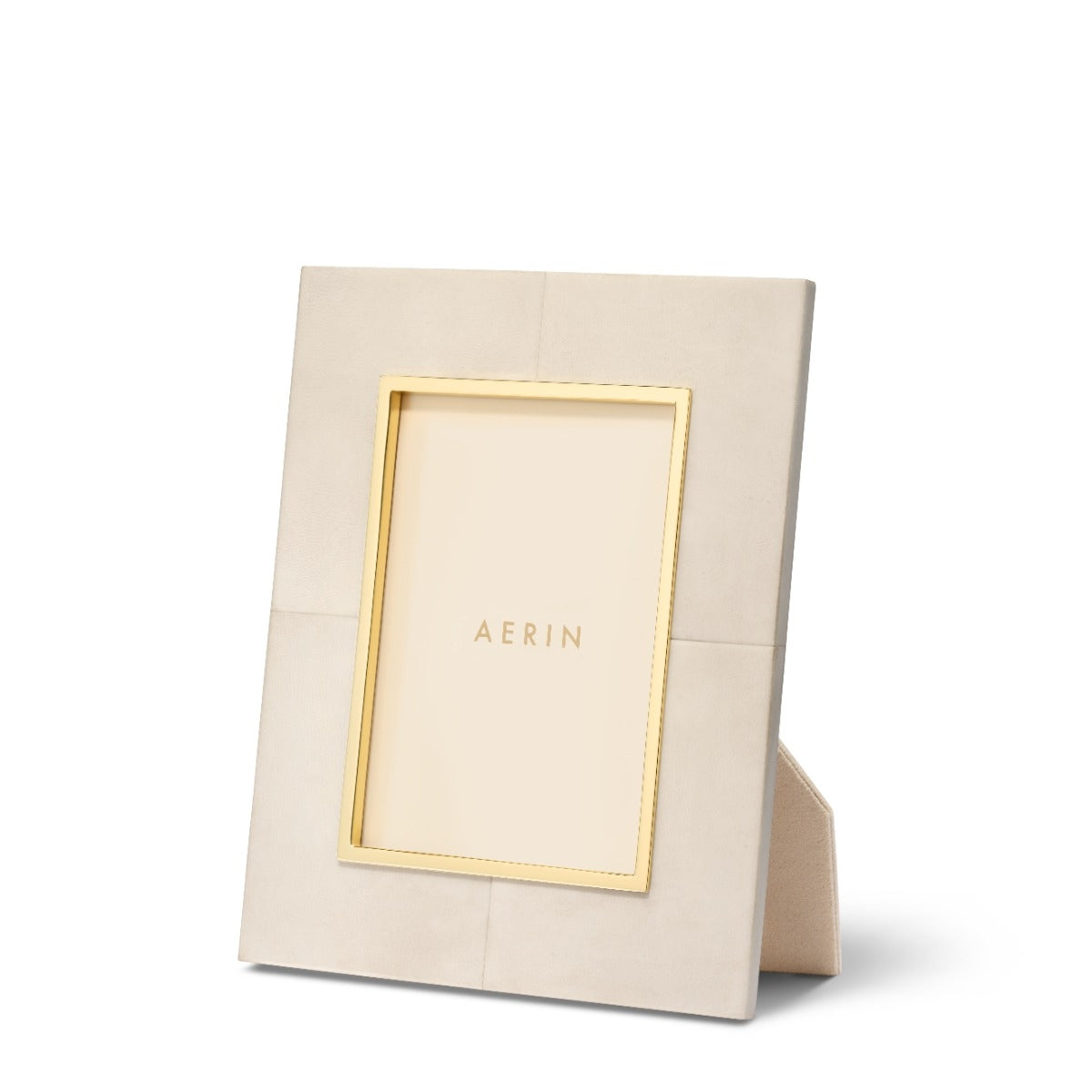 Beige photo frame with gold accents and 'AERIN' branding on a white background