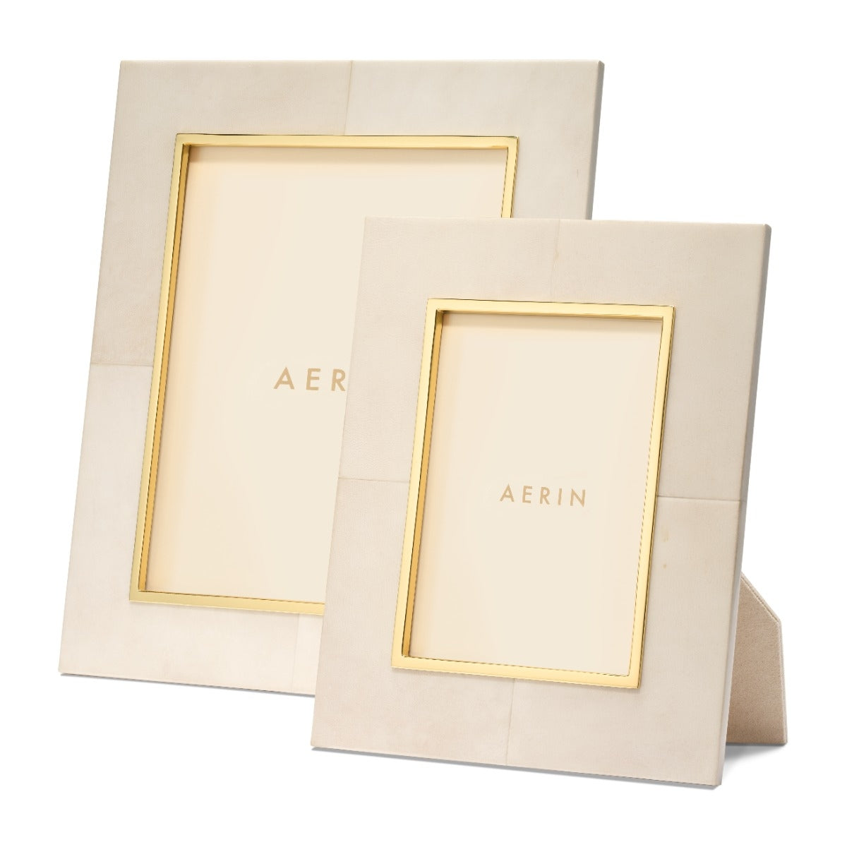 Two beige picture frames with gold edges and 'AERIN' branding on a white background.