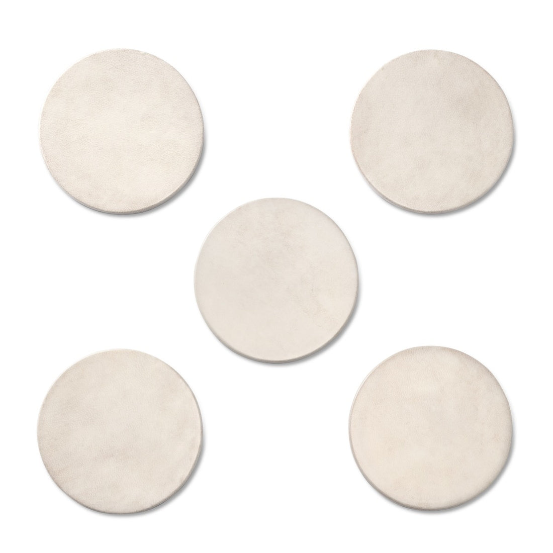 Five round beige coasters on a white background