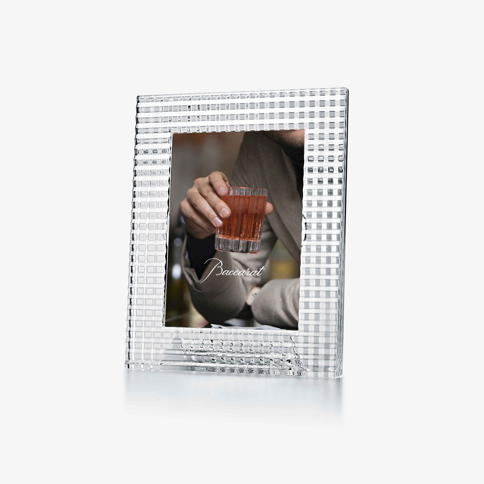 Silver photo frame with a person holding a drink, on a white background
