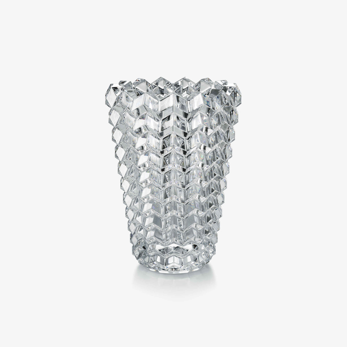 Crystal vase with a geometric pattern on a white background