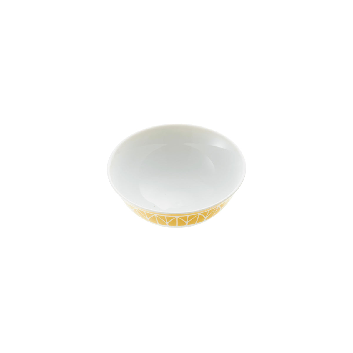 White ceramic bowl with gold interior on a green background