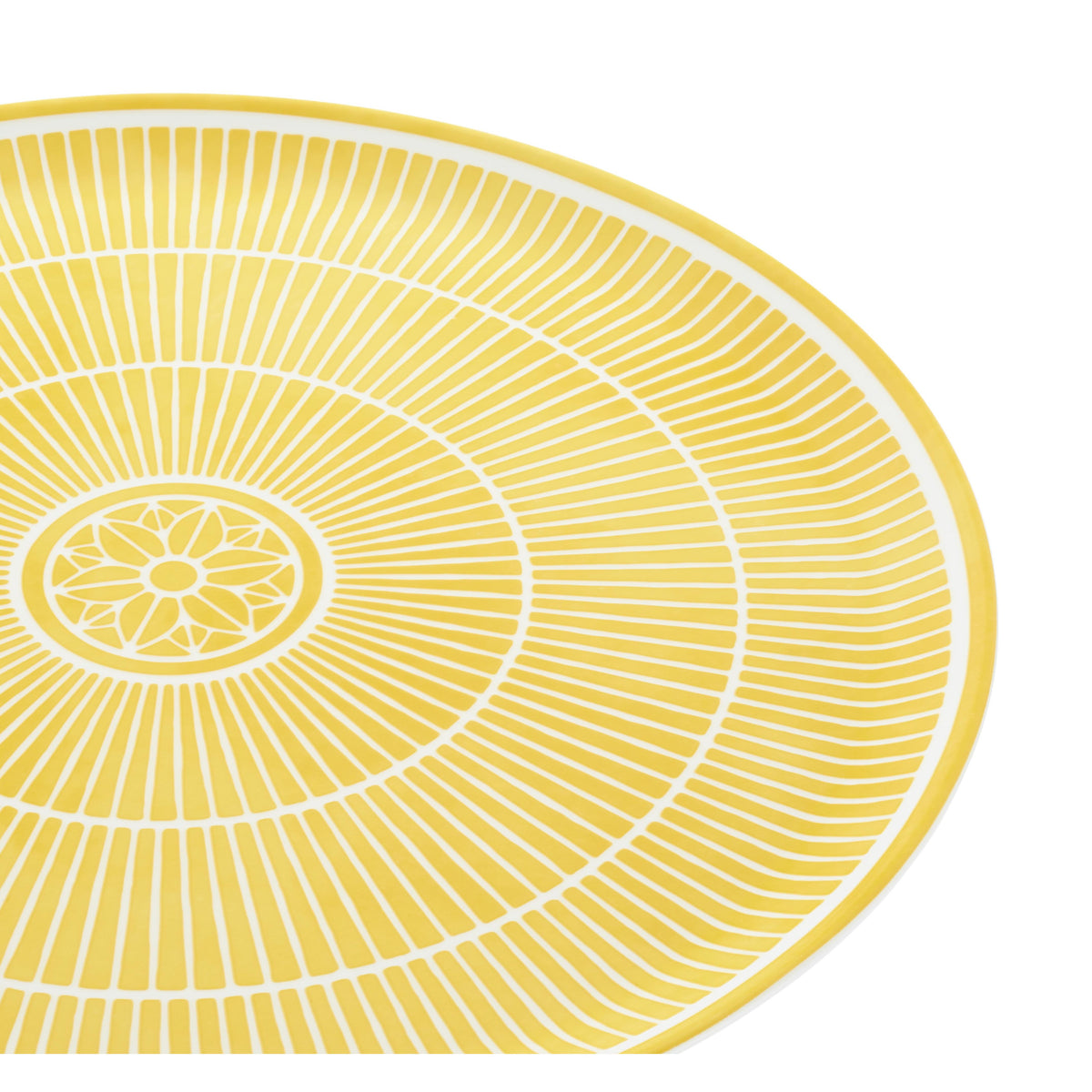 Yellow circular placemat with white concentric circles and floral center on a white background