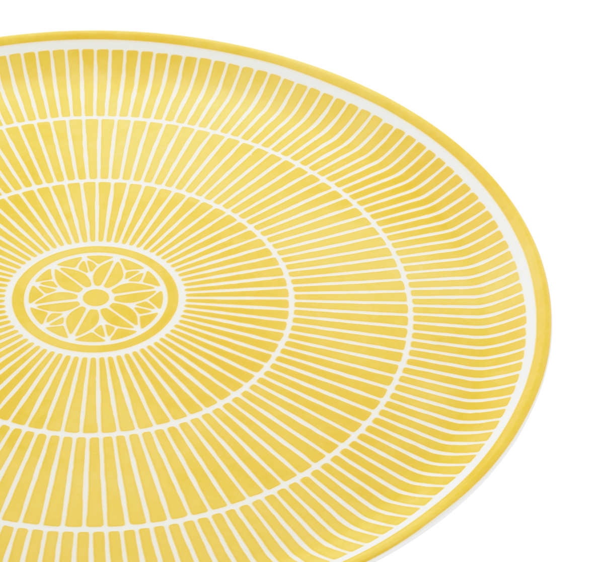 Yellow circular placemat with white concentric circles and floral center on a white background