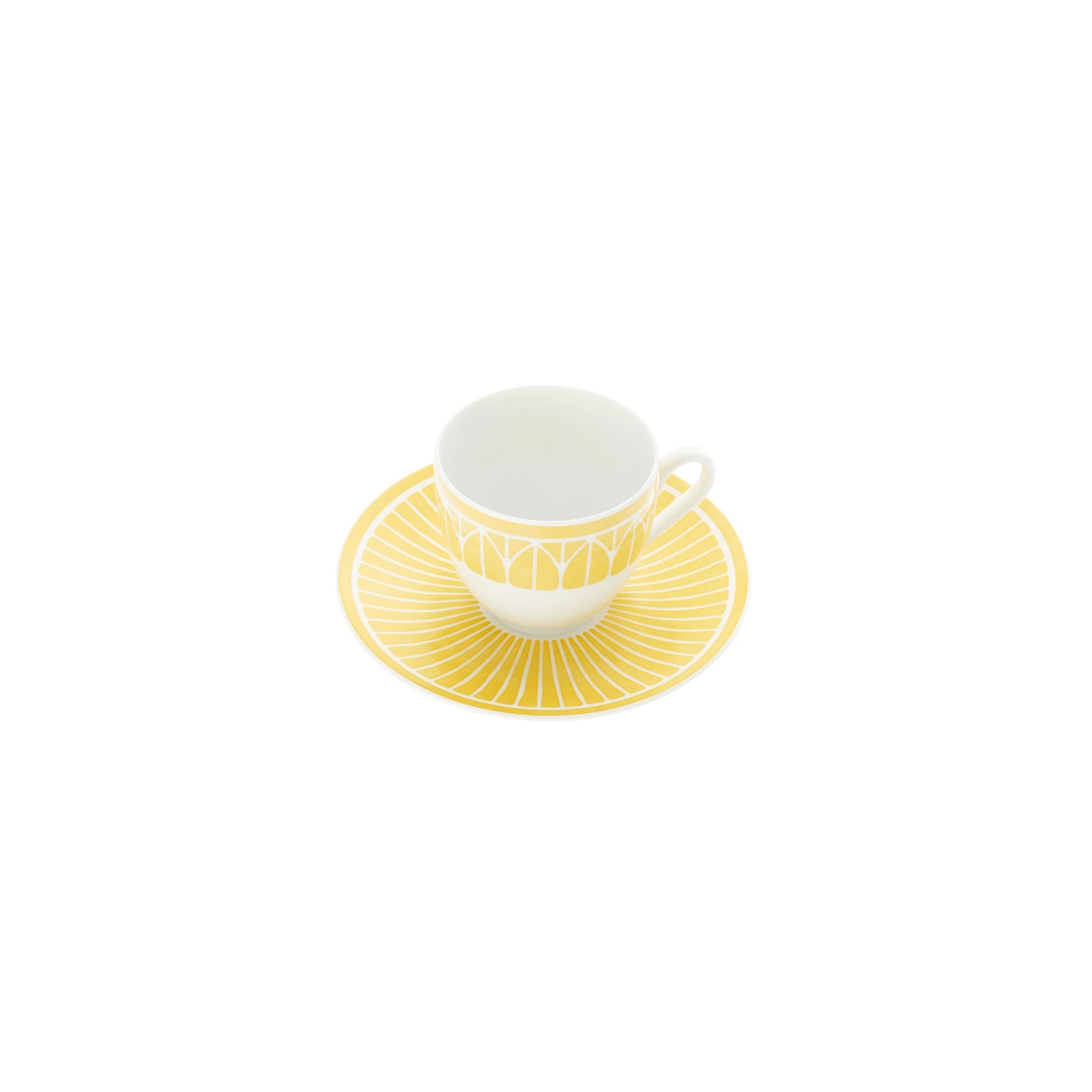 White teacup with yellow interior on a matching saucer against a green background