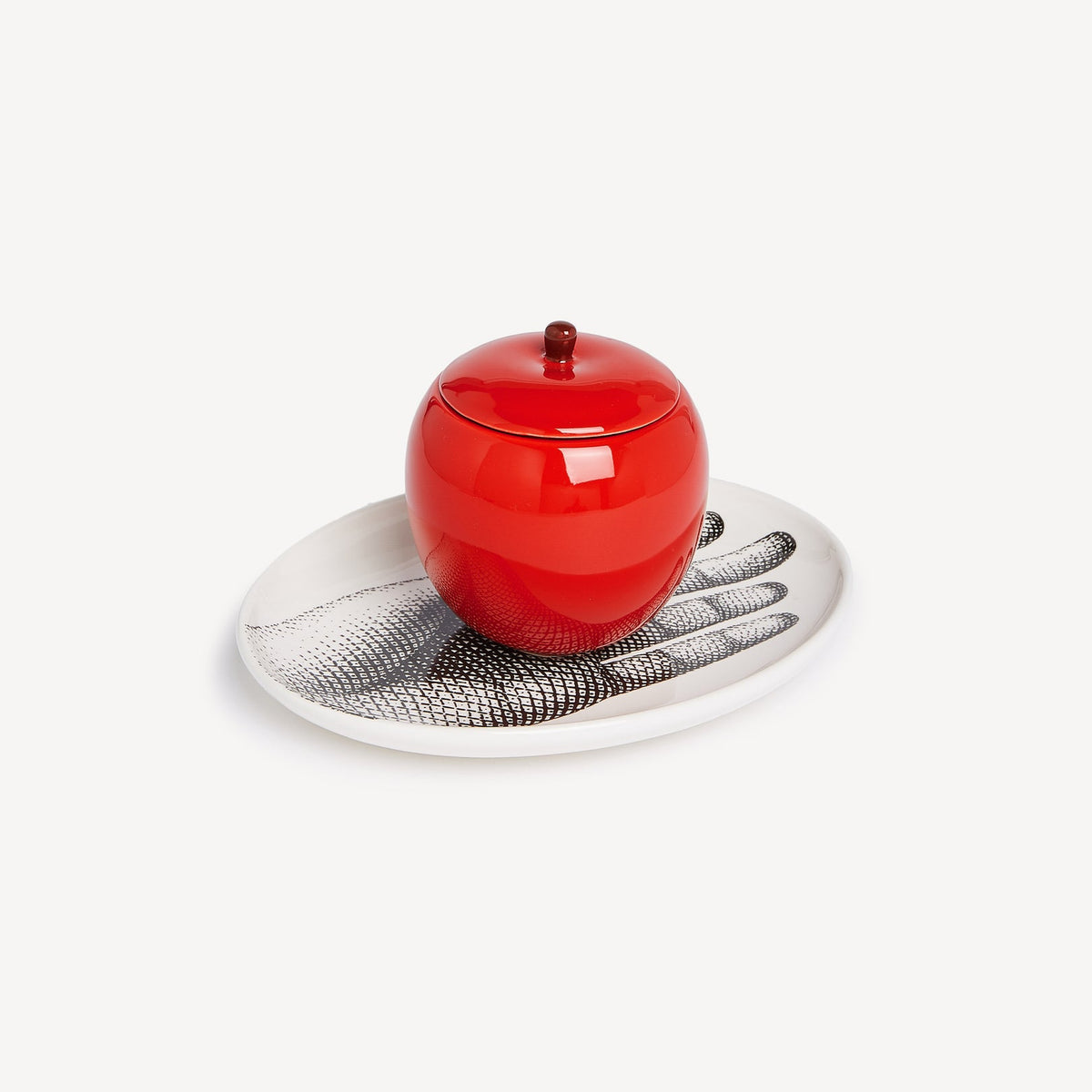 Red ceramic jar with a textured white base on a light gray background