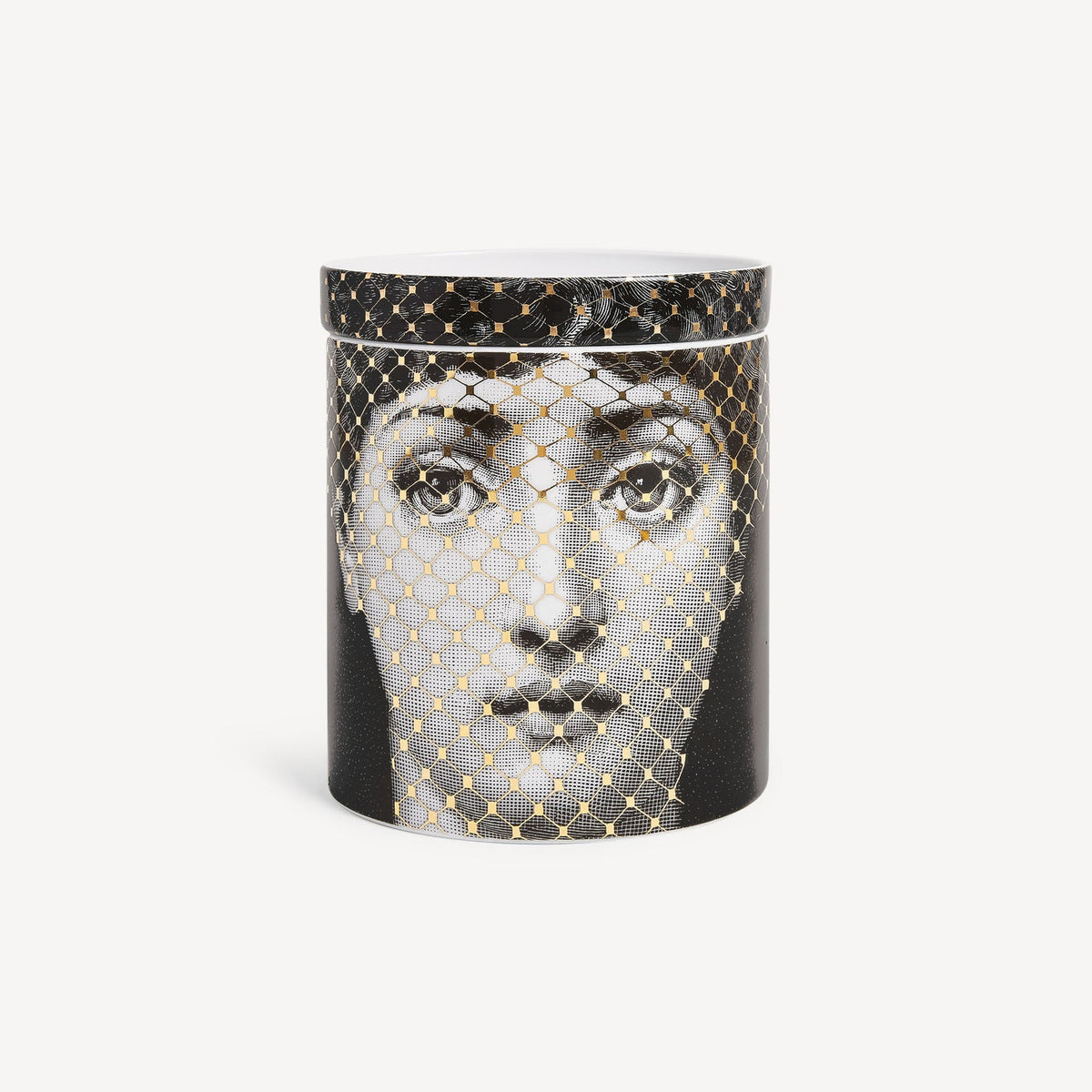 Candle with decorative packaging featuring a face design on a white background
