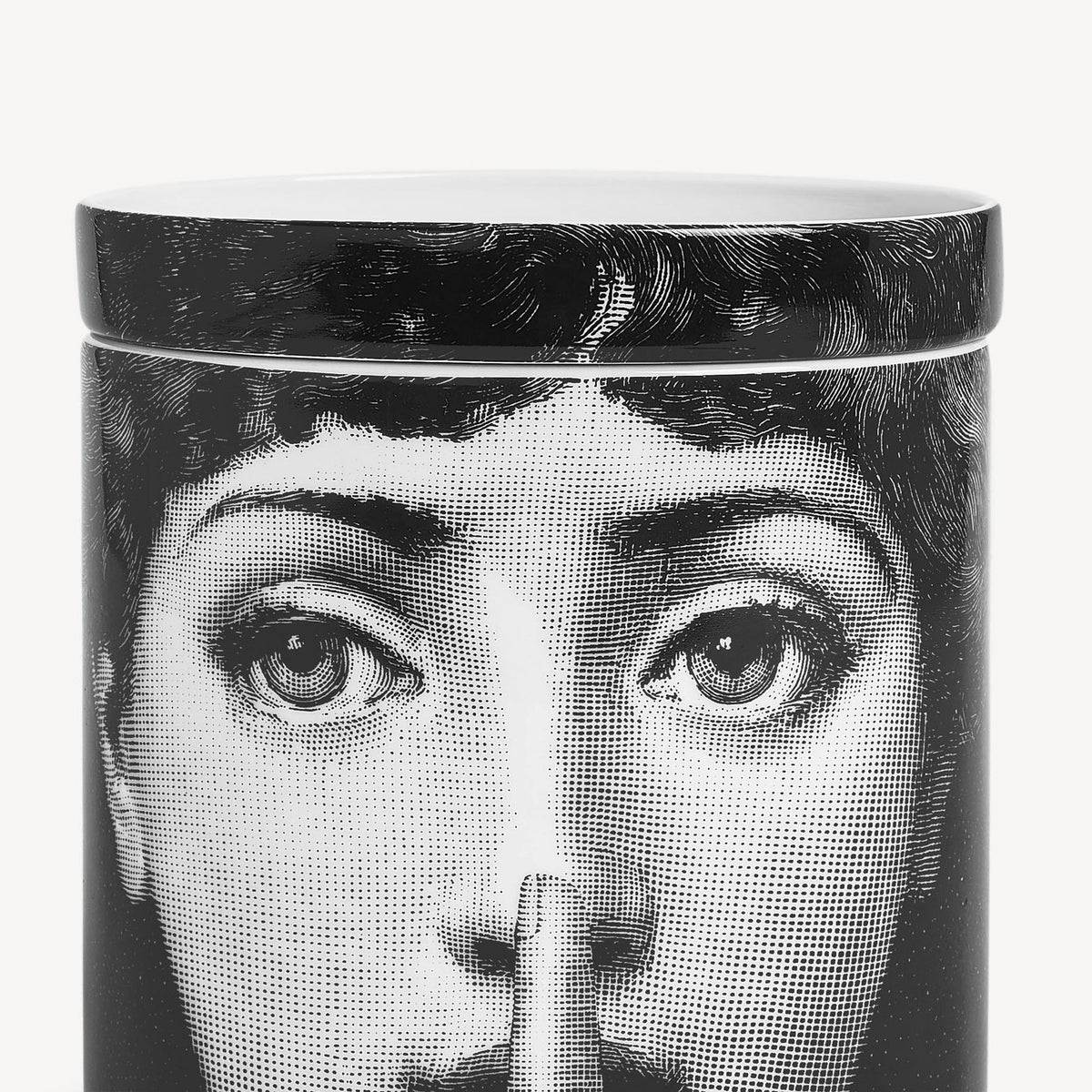 Cylindrical container with a black and white design of a face on a white background