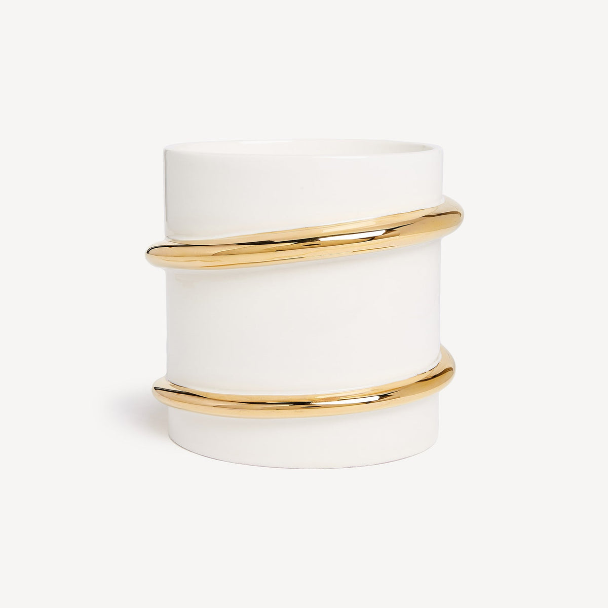 White candle holder with gold bands on a white background