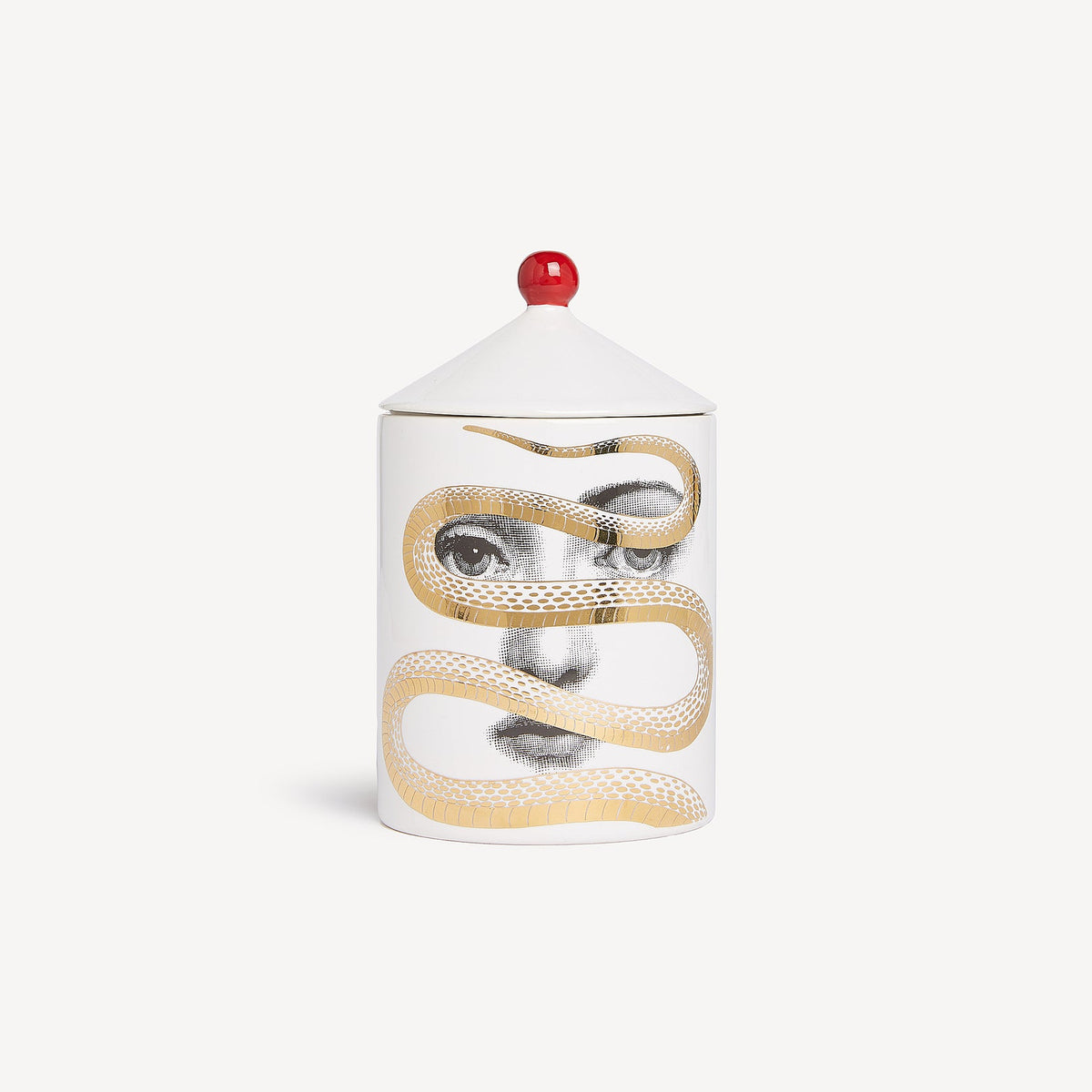 Candle with a design of a face and snake on a white background