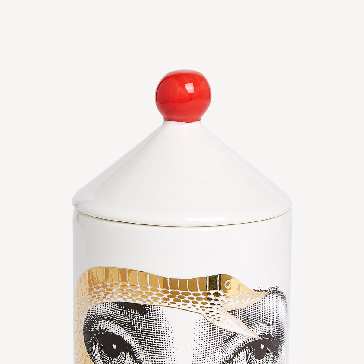 Candle with a decorative lid featuring an animal design on a white background