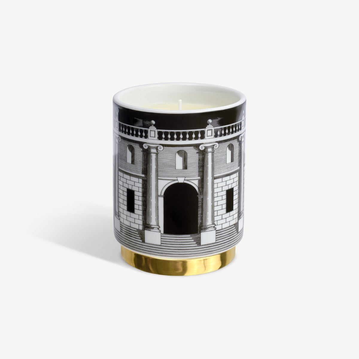Decorative candle with architectural design on a white background