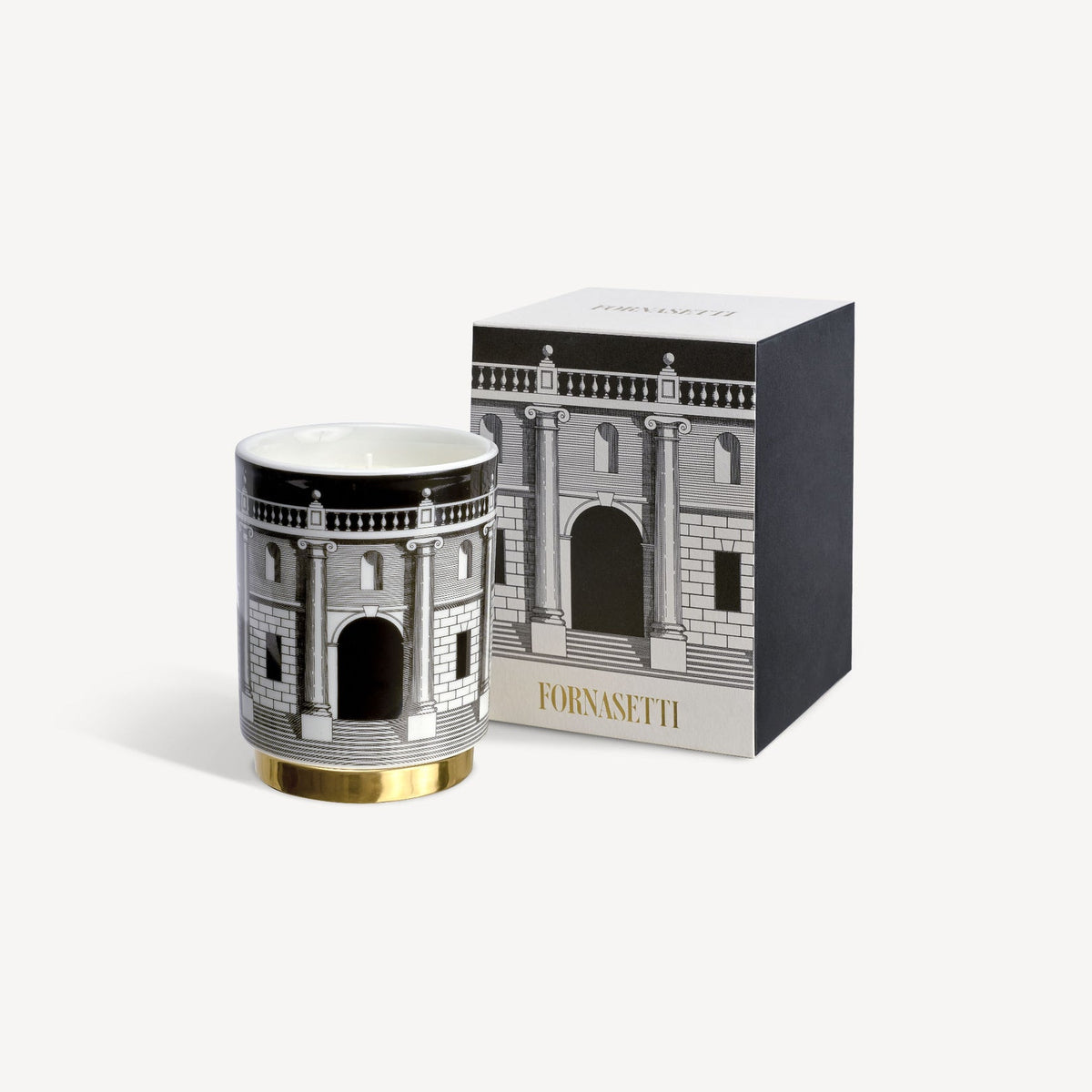 Decorative candle with architectural design and matching box on a white background