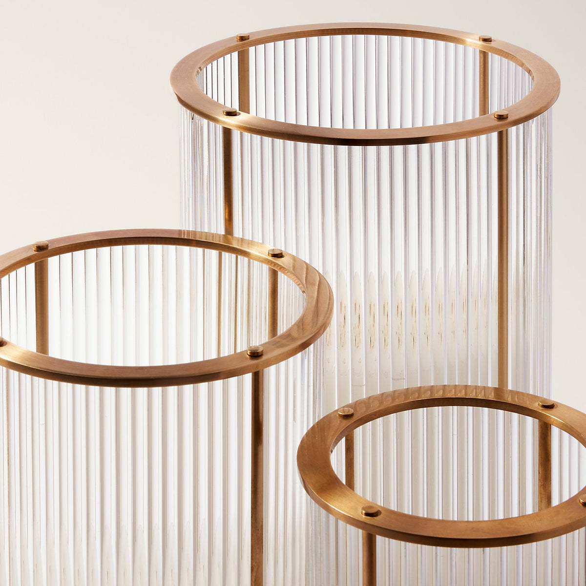 Decorative metal stand with circular gold frames on a light background