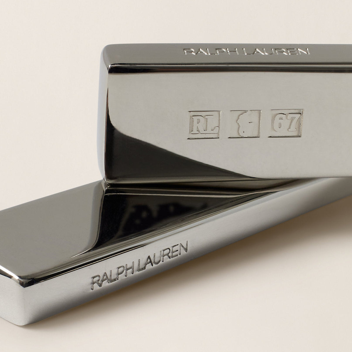 Close-up of a Ralph Lauren tie clip on a light background