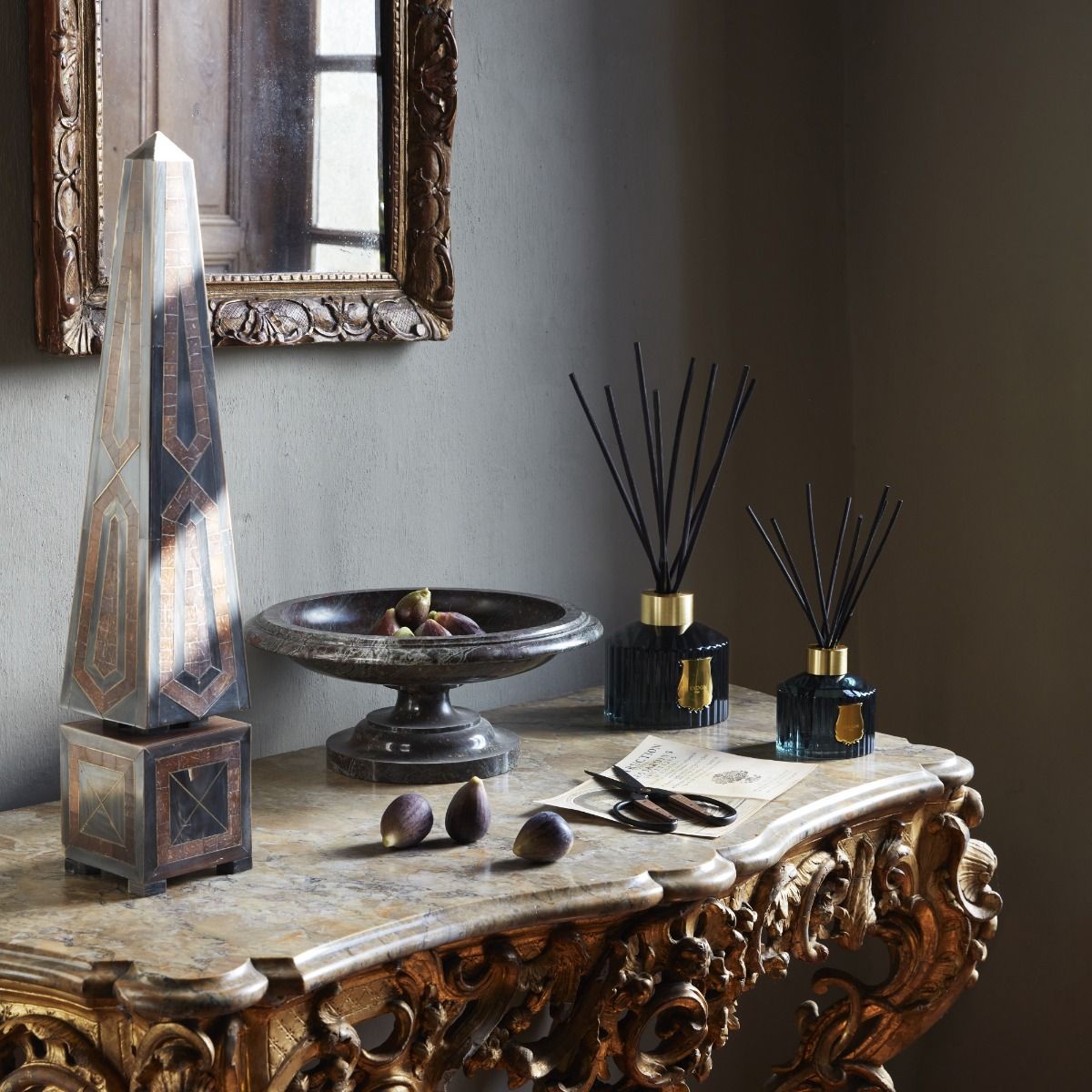 trudon reed diffusers on antique bench
