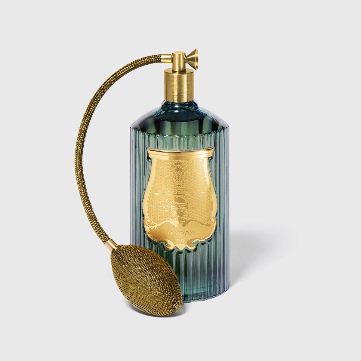 Decorative bottle with gold accents on a light gray background
